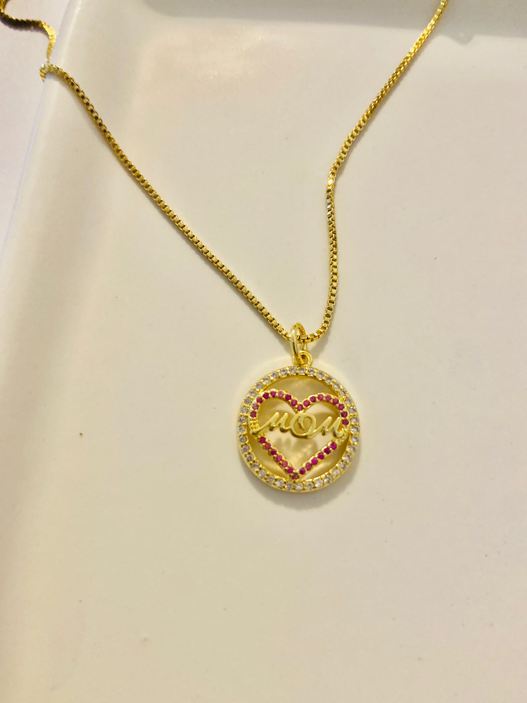 Gold dipped Mom has my heart necklace!